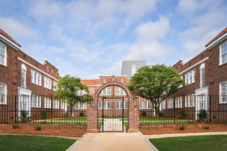 entrance to a large brick apartment building