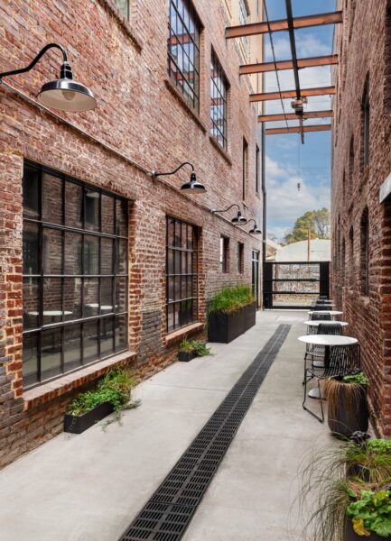 walkway between two brick buildings