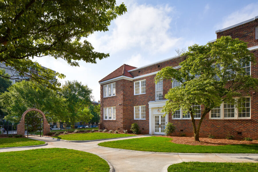 sidewalks in front of a residential brick building