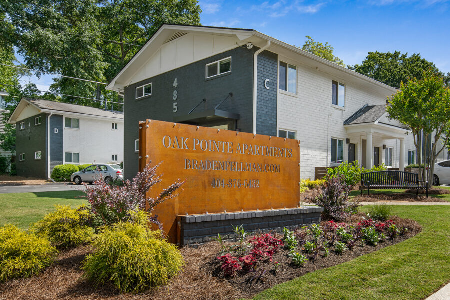 apartment buildings with a sign in front