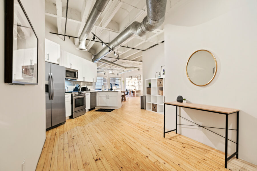 open kitchen and living room with wood floors