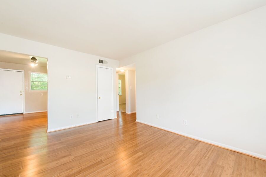 empty open living room with wood floors