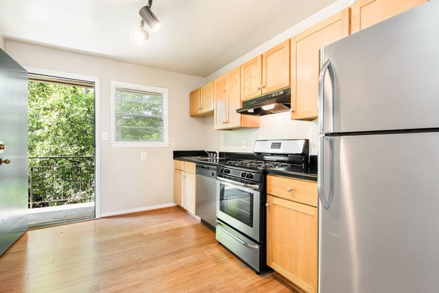 kitchen with black countertops and wood floors