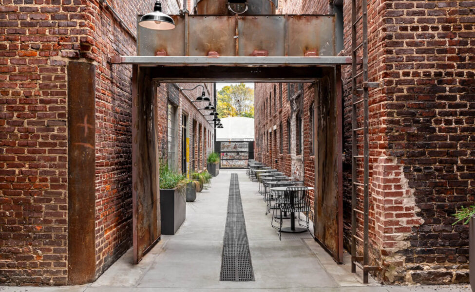 outdoor space between two brick buildings