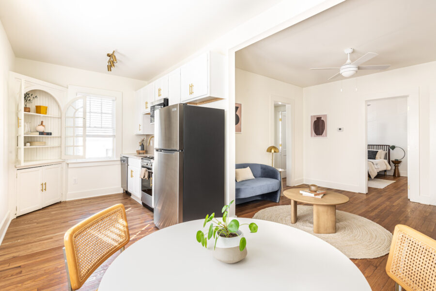 an open kitchen, dining room and living room